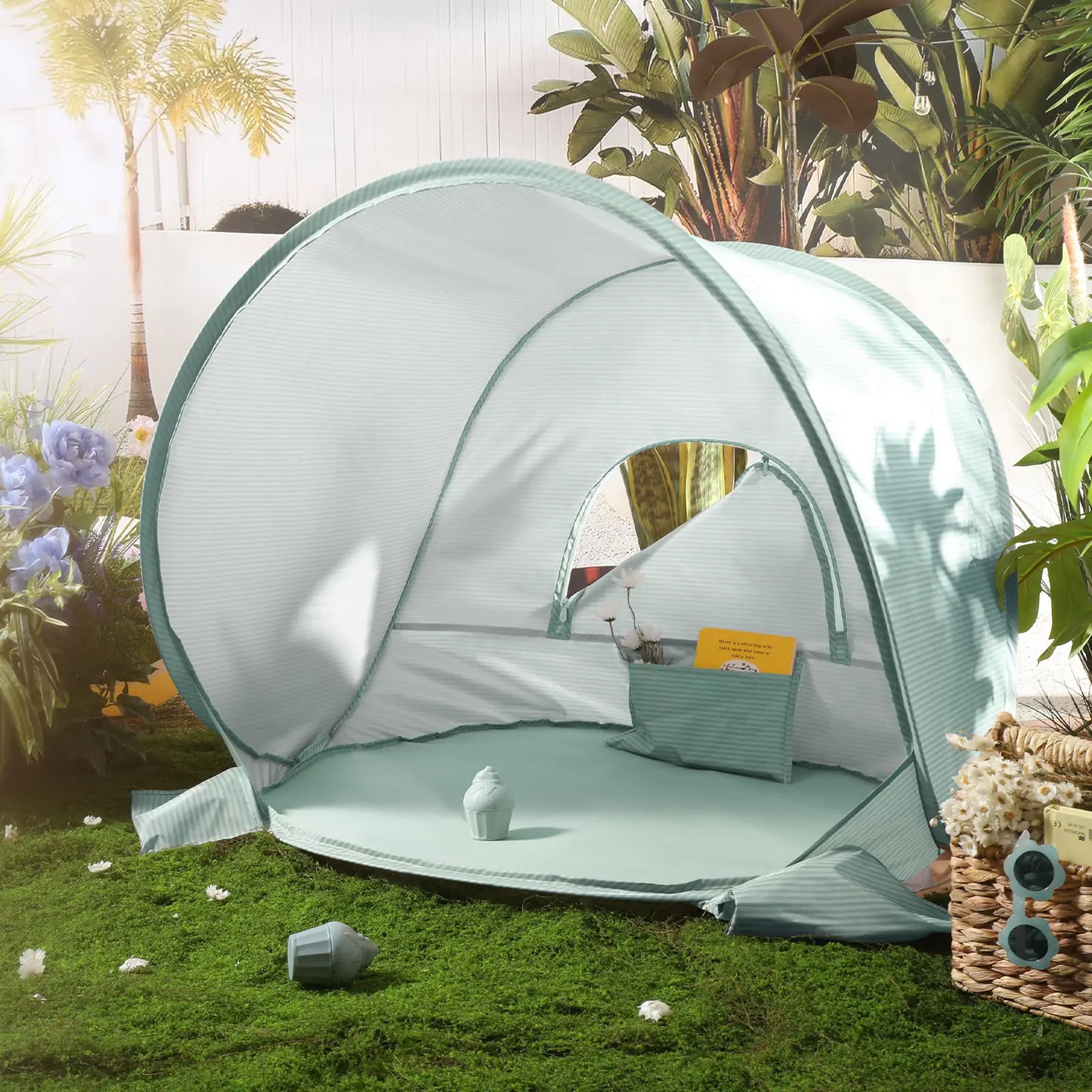 The Tiny Land® One-Stop Beach Toy & Tent Set in Sea Blue offers UV protection and a cozy interior, perfect for outdoor retreats. Surrounded by plants and flowers, it creates a sunny space for relaxation on the grass.|Sea Blue